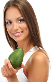 smiling-young-woman-holding-an-avocado